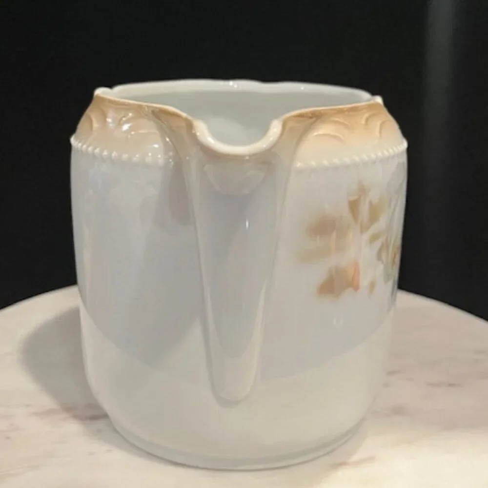 German Porcelain Large Creamer with Roses and Beaded Handle